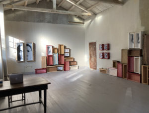 installation view of artwork spanning two opposing walls
